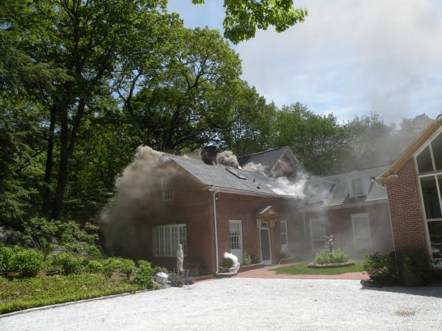 Smoke showing as first FD units arrive at 77 Chesnut Ridge Road, Bedford Hills. (Spring 09)